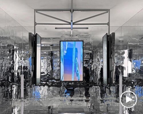 three suspended digital screens translate AI imagery into luminous spatial installation