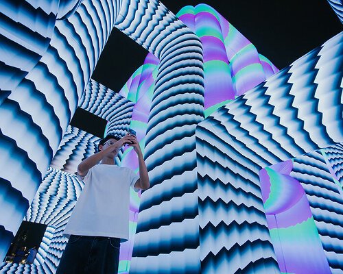 cyril lancelin’s tubular installation becomes a walkable cube of light and color in singapore
